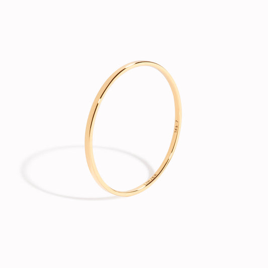 Thin stacking ring made with 14k solid gold