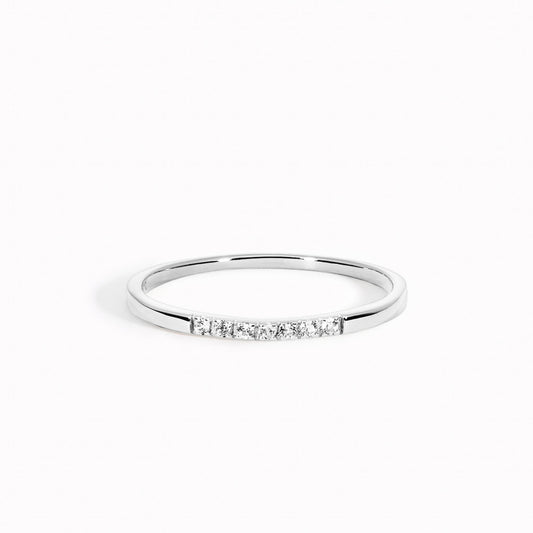Half eternity pave ring with 7 hand-set white topaz gemstones on silver band