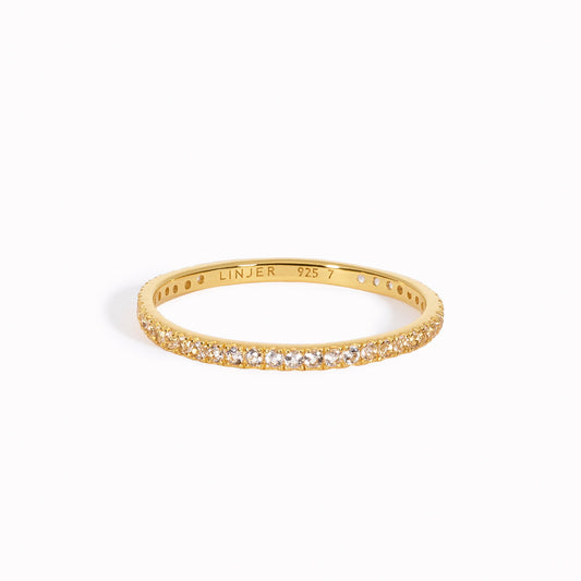 White topaz eternity ring in gold vermeil on white background