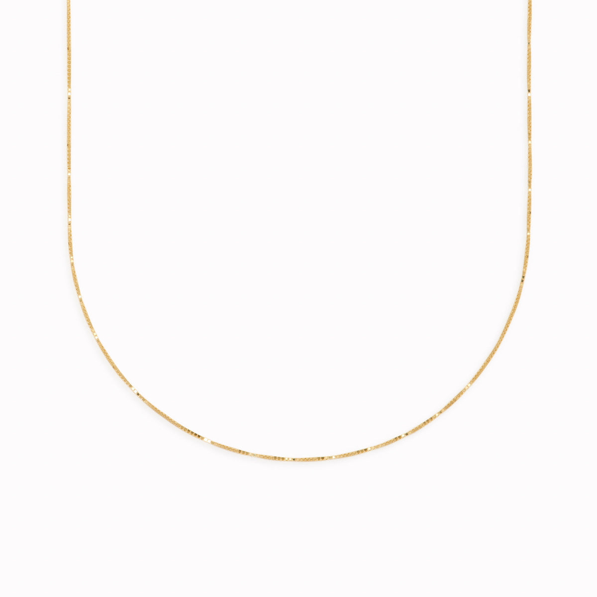 14k gold box chain necklace with a fine, minimalistic design on a clean white background