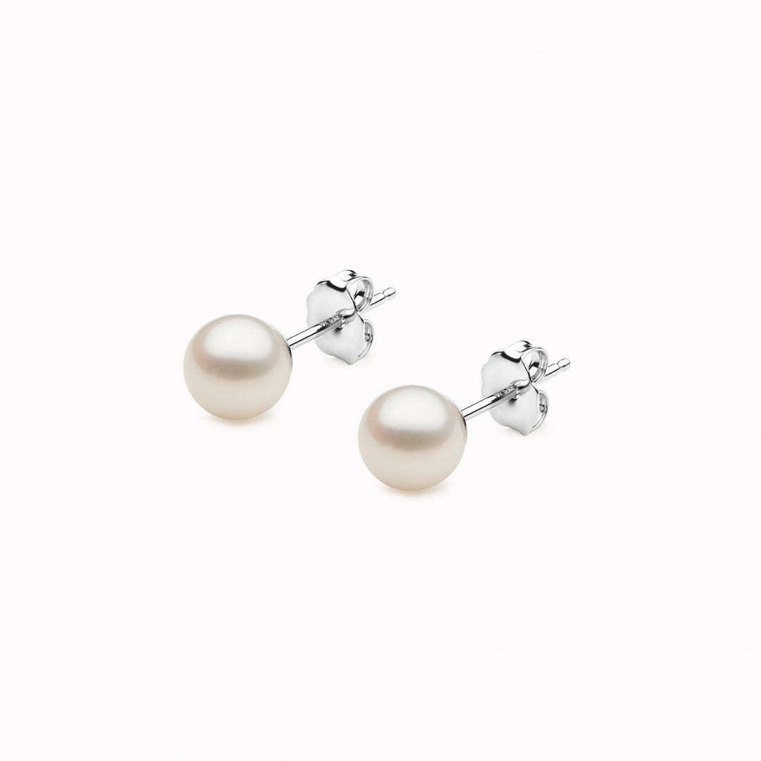Round pearl stud earrings with butterfly backing in silver