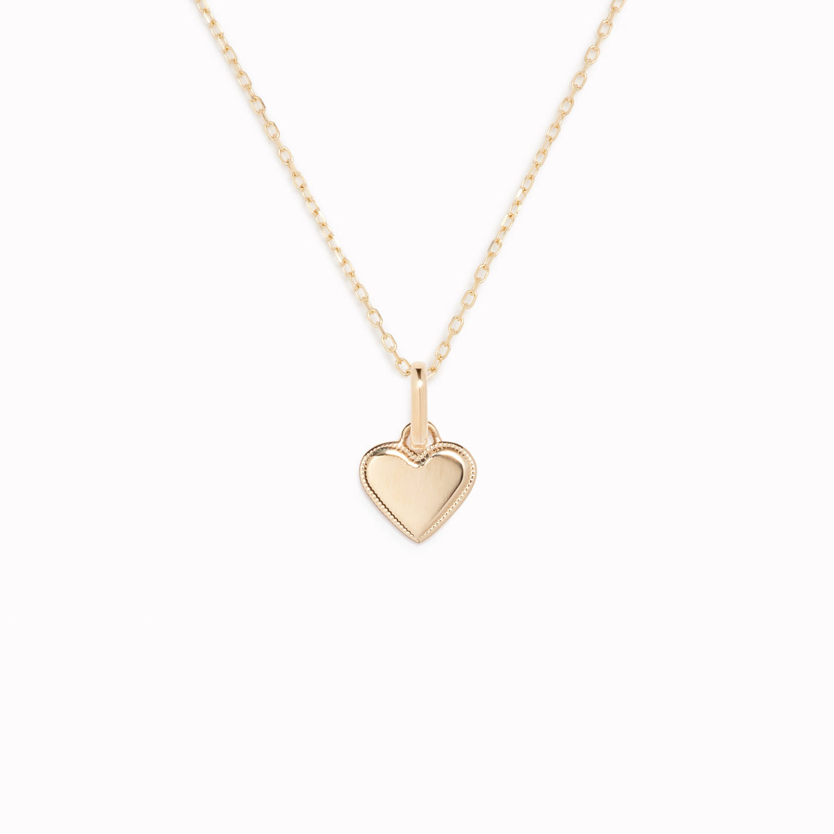 Heart Charm 14k Gold pendant with delicate beaded border on a fine chain displayed on a white background