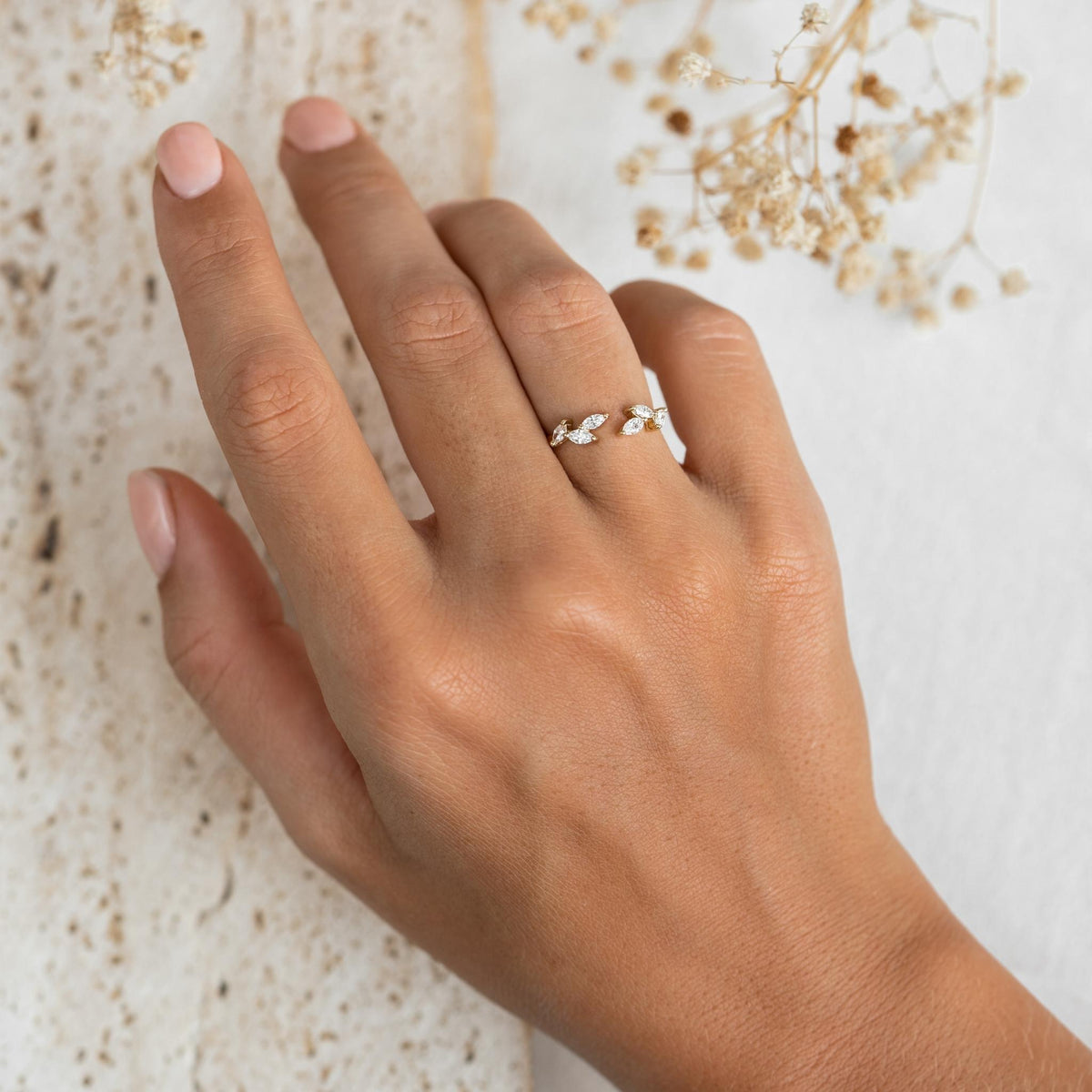 14k gold open leaf ring with lab grown diamonds in laurel leaf design on model