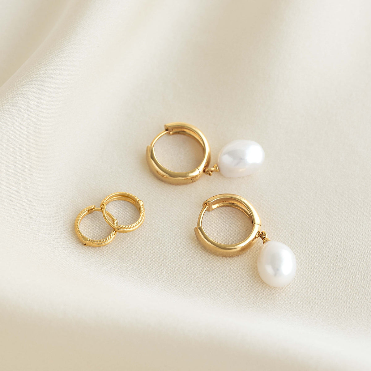 Baroque Pearl Chunky Hoop Earrings - Meredith featuring gold vermeil hoops with freshwater baroque pearl drops on cream fabric background