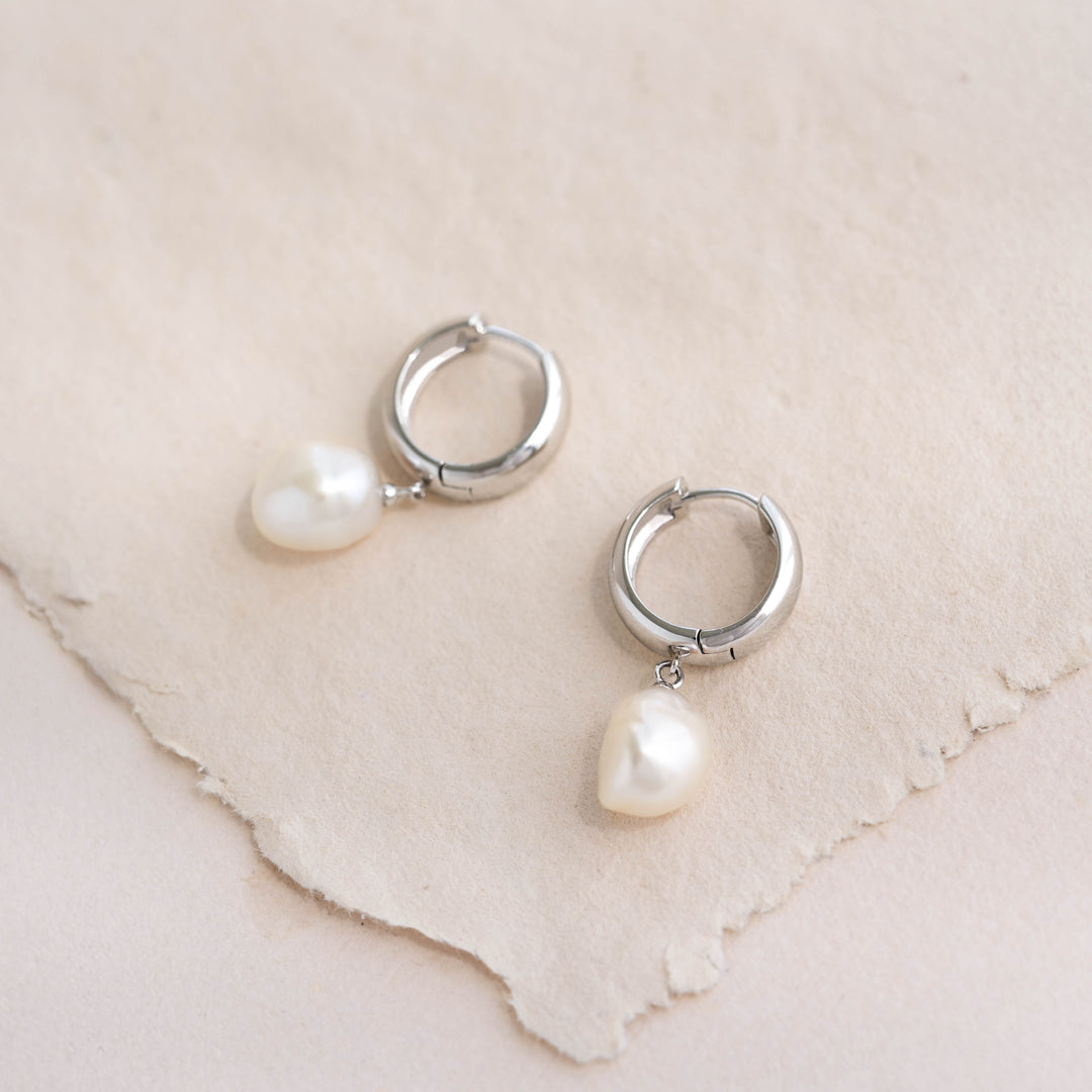 Close-up of Baroque Pearl Chunky Hoop Earrings Silver - Meredith featuring sterling silver hoops with freshwater pearls on neutral background