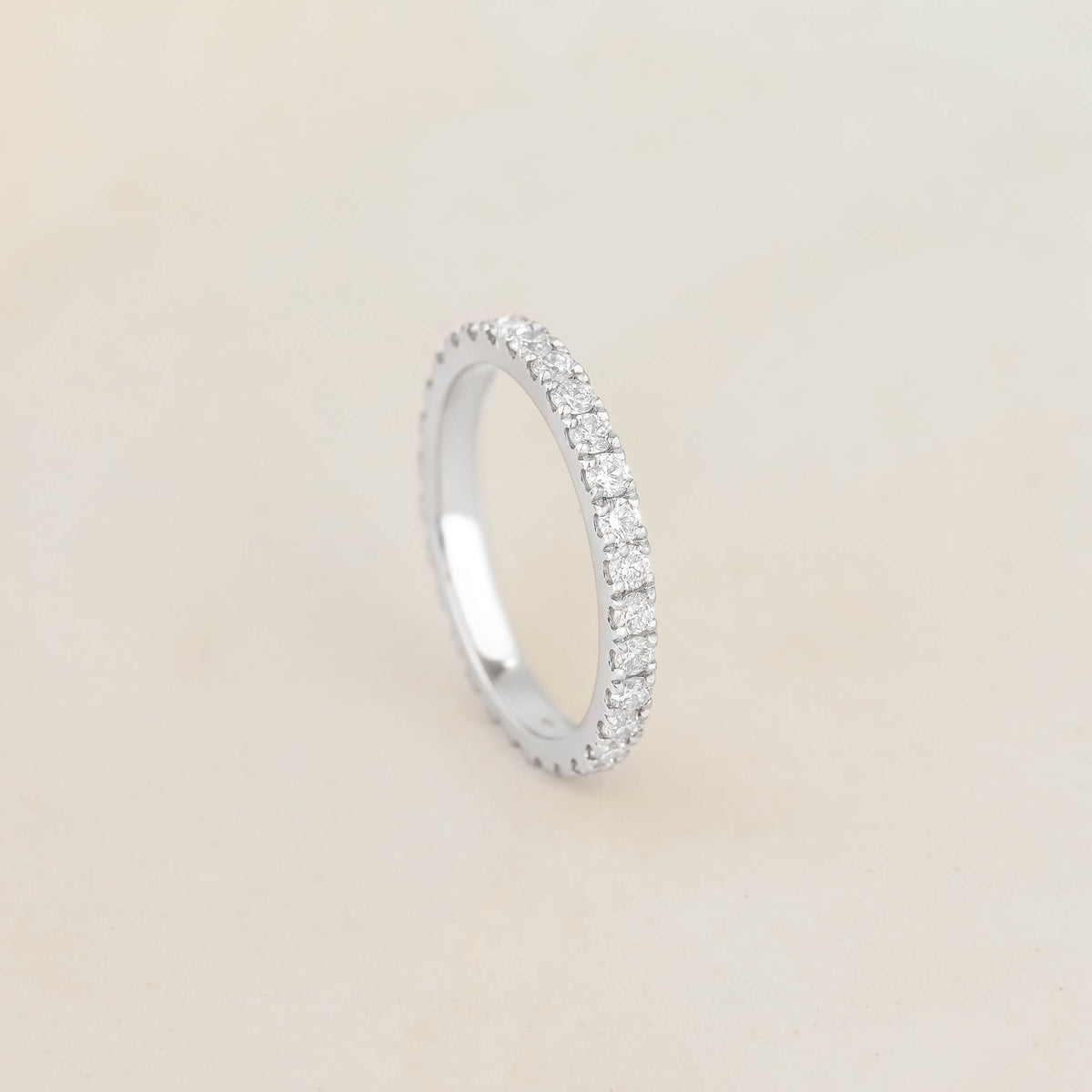 A stunning white gold diamond eternity ring, showcasing a seamless circle of brilliant diamonds for timeless elegance.