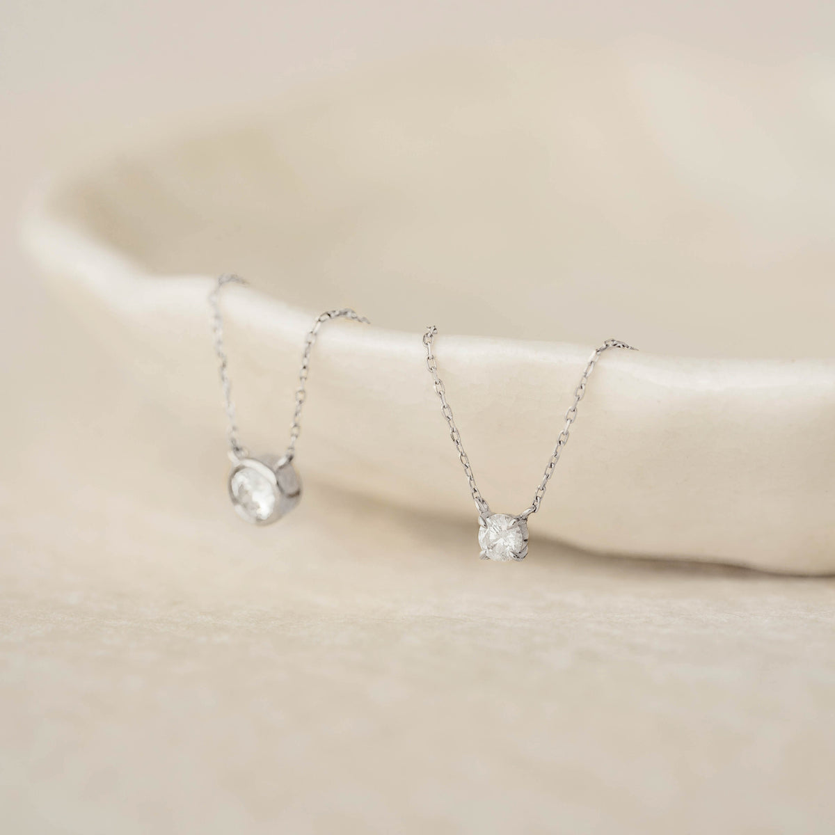 Close-up of Diamond Pendant Necklace White Gold - Johanne featuring a floating diamond on a delicate white gold chain