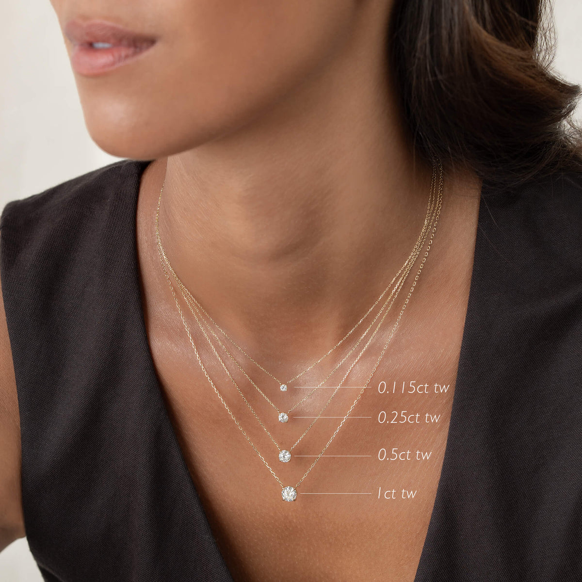 Elegant layered Gold necklaces featuring various diamond weights, showcasing a stylish look for any occasion.
