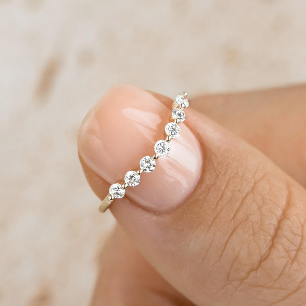 Curved lab grown diamond ring on 14k yellow gold band