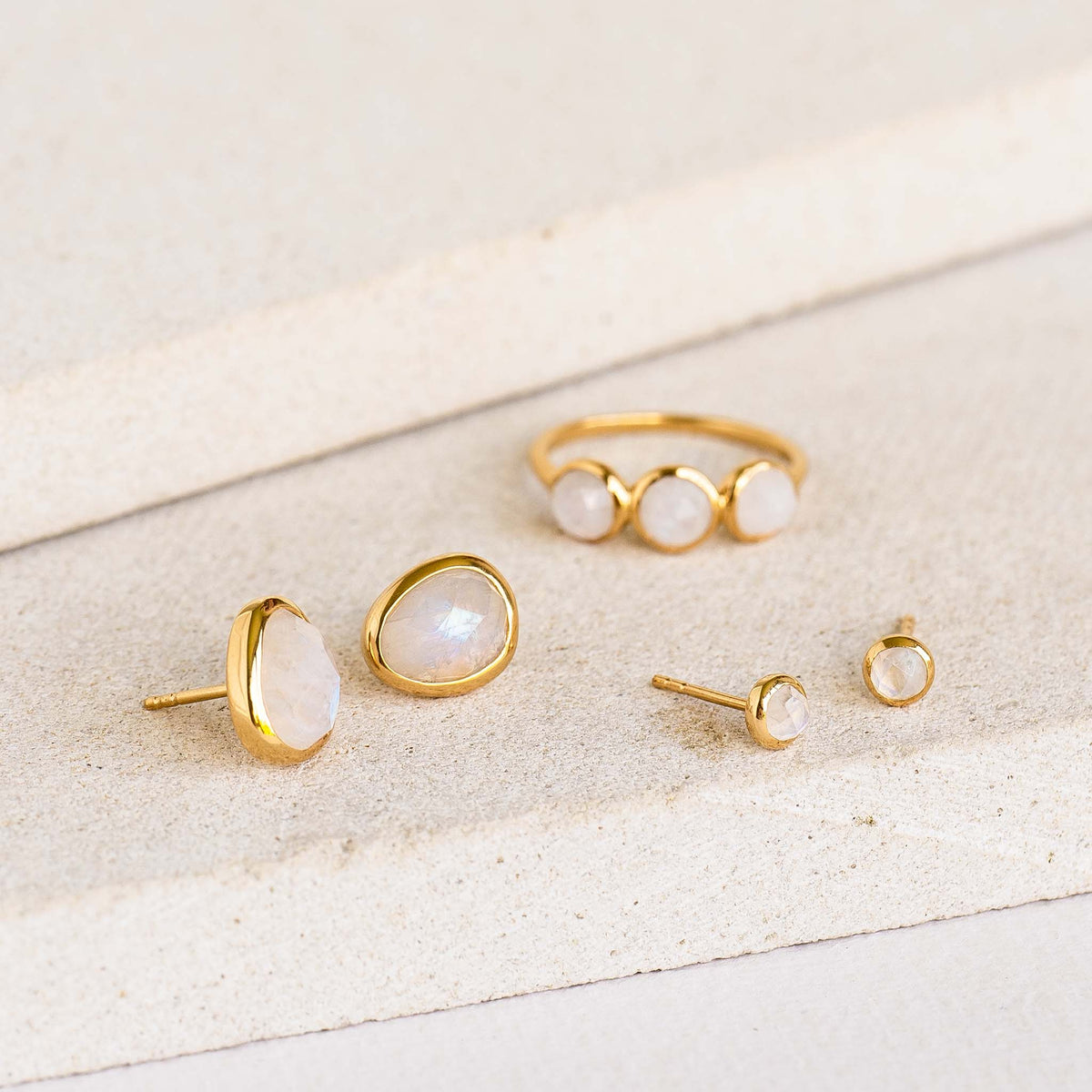 Assortment of rainbow moonstone earrings and matching ring