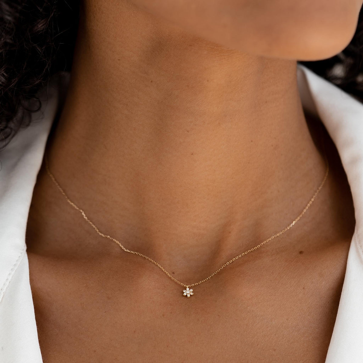 14k yellow gold flower pendant necklace on model
