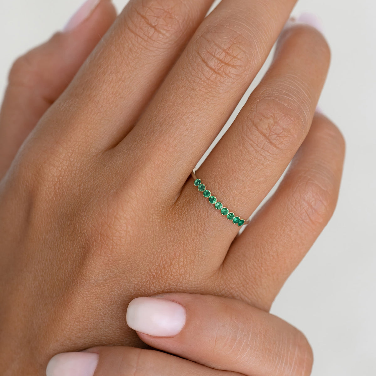 May Birthstone Ring 14k Gold - Green Chalcedony with nine small round green gemstones on a hand