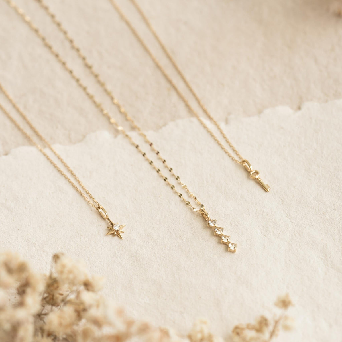 Opal Charm 14k Gold pendant with delicate gold chain displayed on a soft neutral background