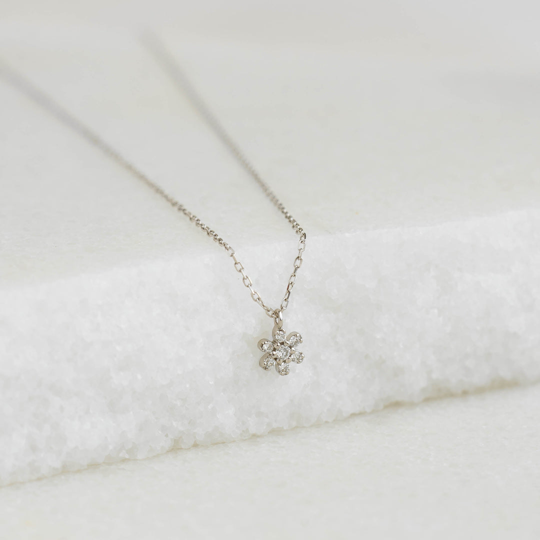 Diamond Flower Necklace White Gold - Haldis featuring a delicate seven-diamond flower pendant on a fine chain