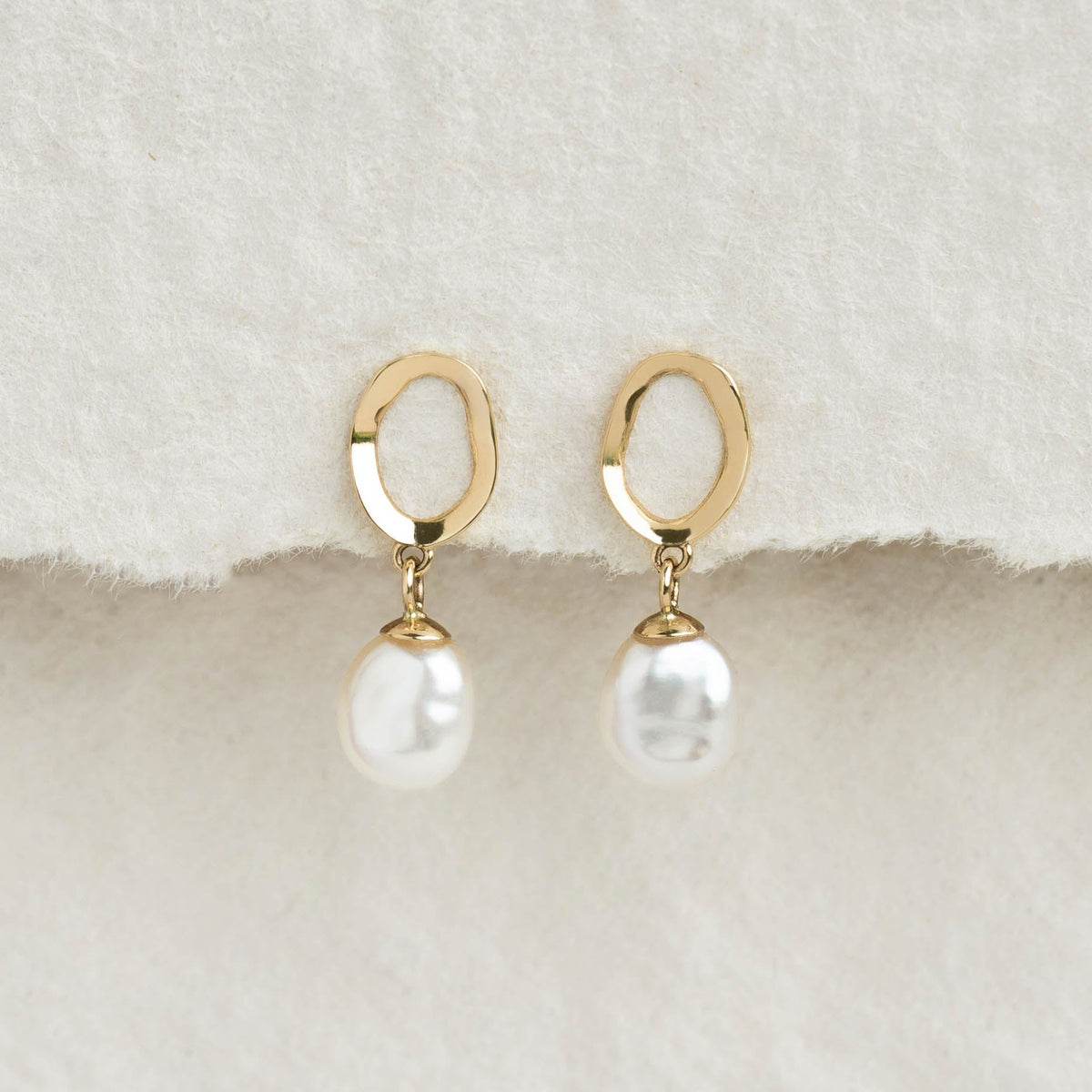 Pearl Drop Earrings 14k Gold - Marlowe featuring keshi freshwater pearls with hammered organic gold settings on soft fabric background