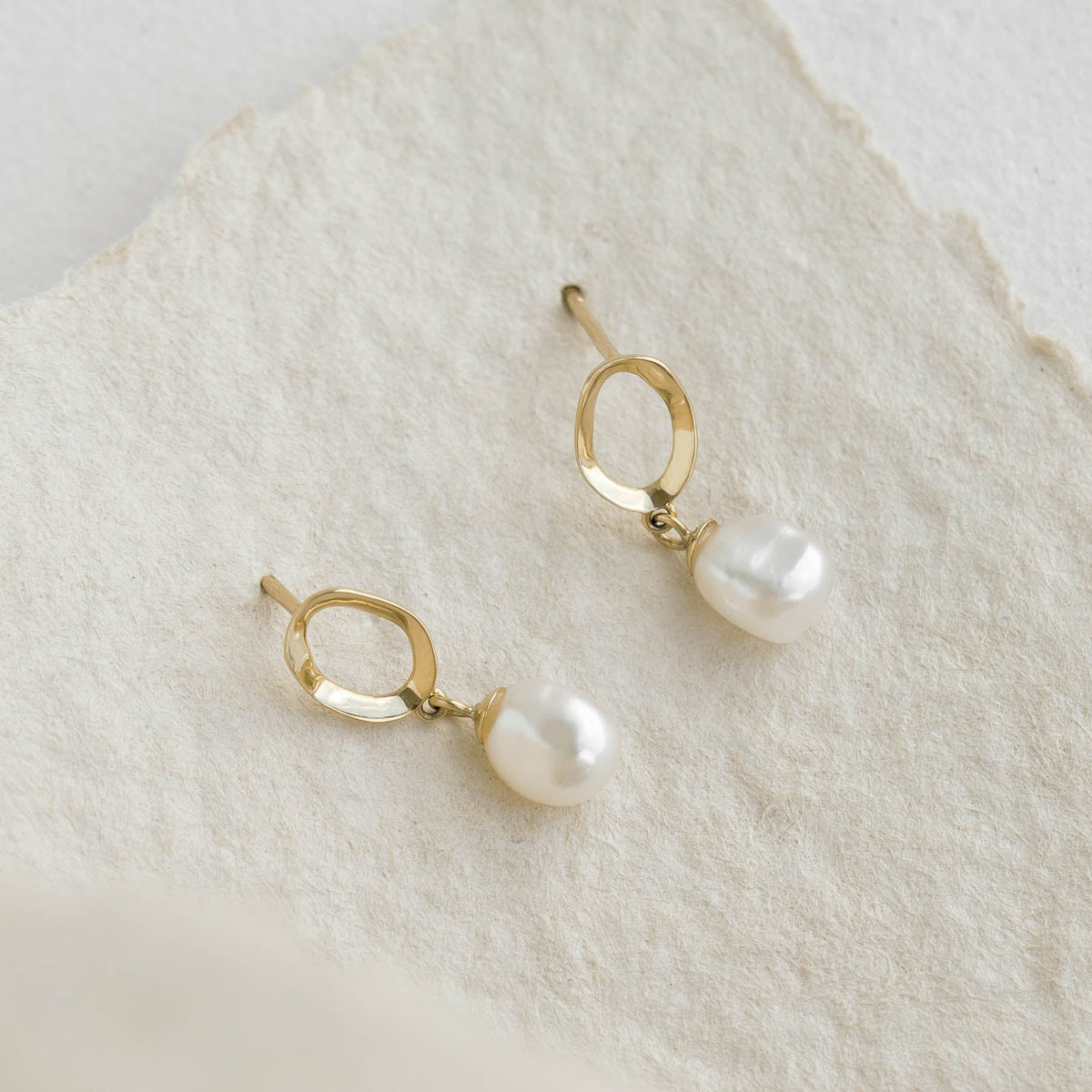 Pearl Drop Earrings 14k Gold - Marlowe featuring keshi freshwater pearls on hammered organic 14k gold setting displayed on textured background