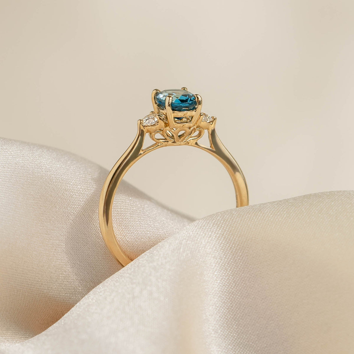 London Blue Topaz and Diamond Ring 14k Gold - Kindra showing the oval blue topaz and diamond accents on a yellow gold band