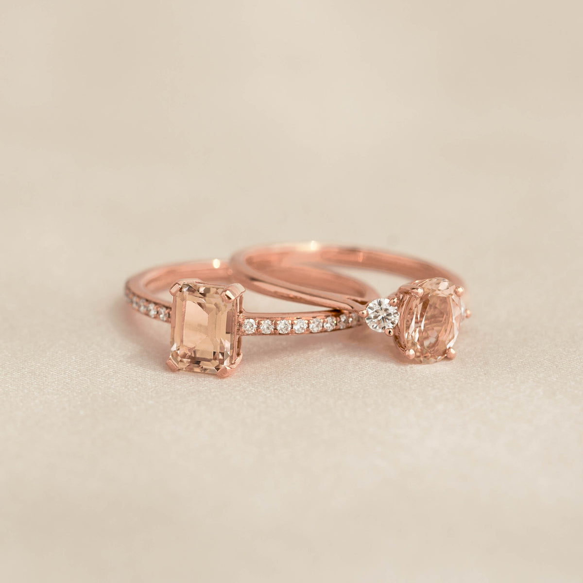 Close-up of Baguette Morganite and Diamond Ring Rose Gold - Safiya with baguette-cut morganite and pavé diamonds on beige background