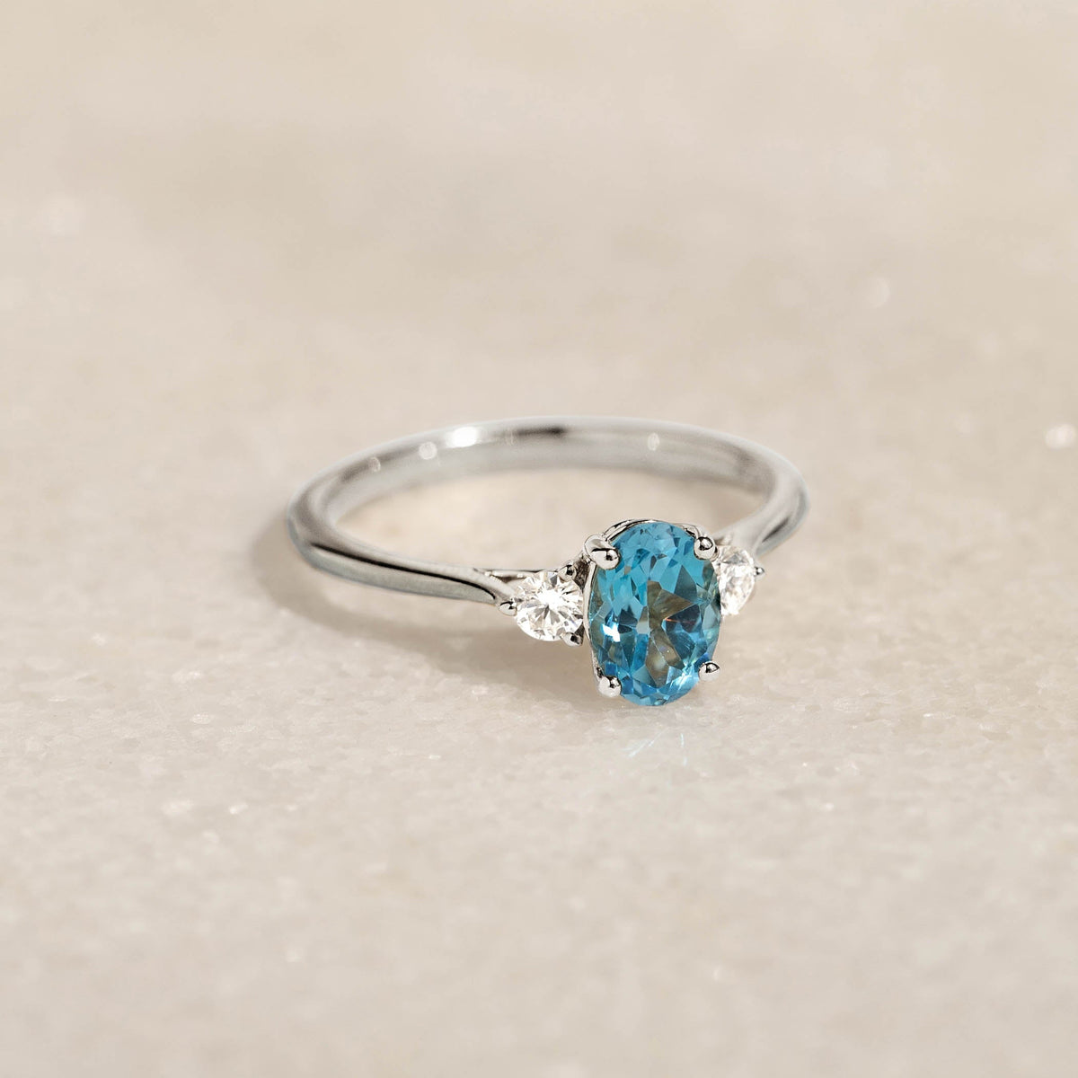 Swiss Blue Topaz and Diamond Ring White Gold - Kindra with oval-cut blue topaz and two side diamonds on white gold band