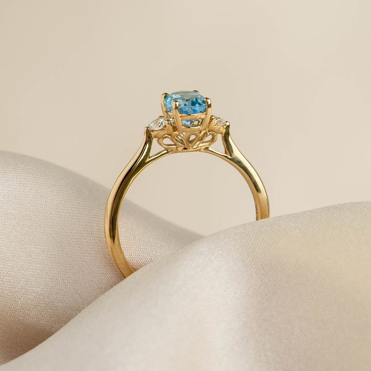 Swiss Blue Topaz and Diamond Ring 14k Gold - Kindra with oval blue topaz and diamond accents in cathedral setting