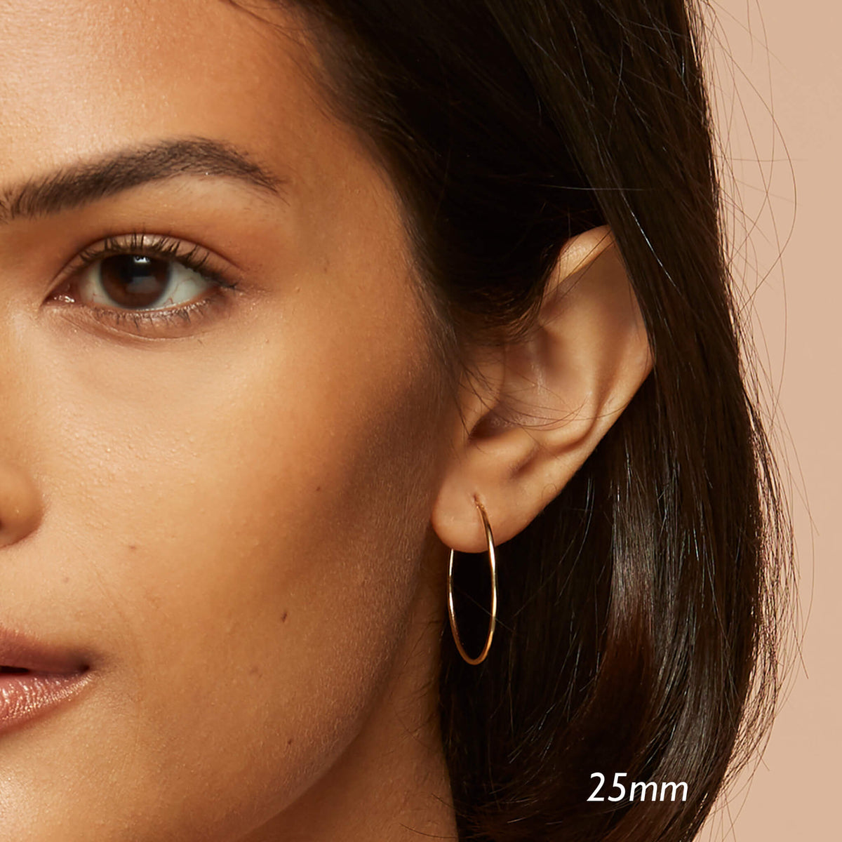 Large hoops in 14K gold on model