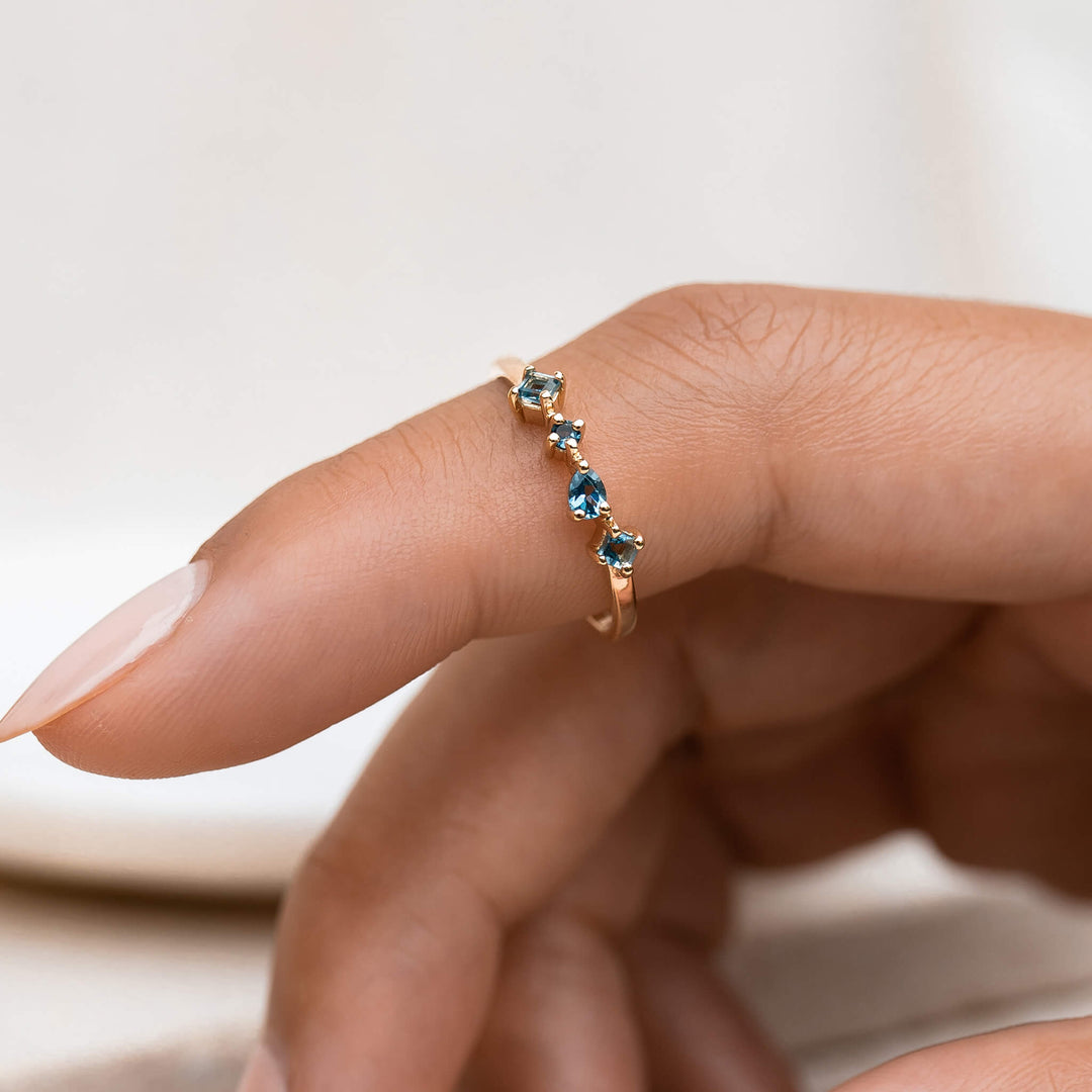 14k gold ring with irregular london blue topaz gemstones 