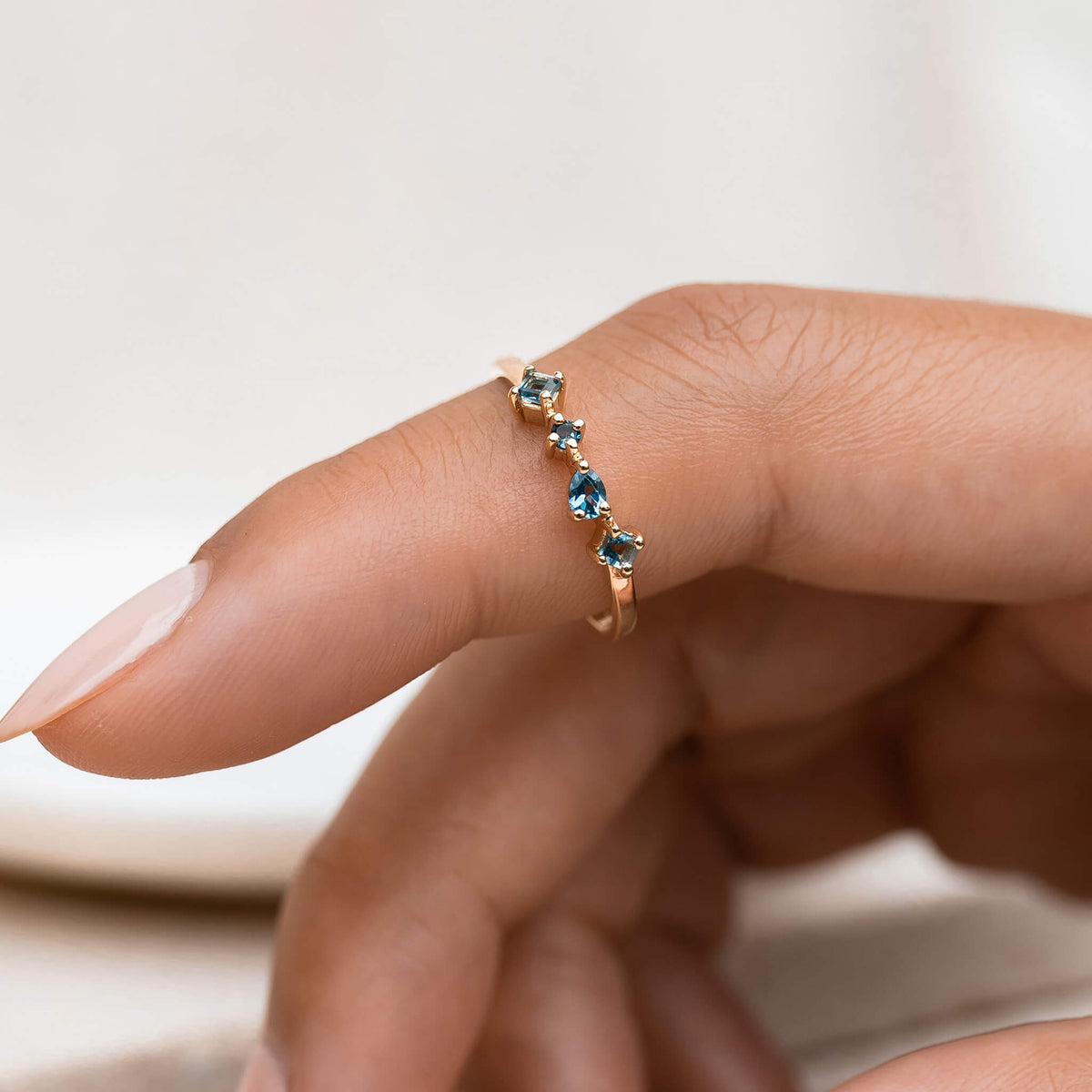 14k gold ring with irregular london blue topaz gemstones 