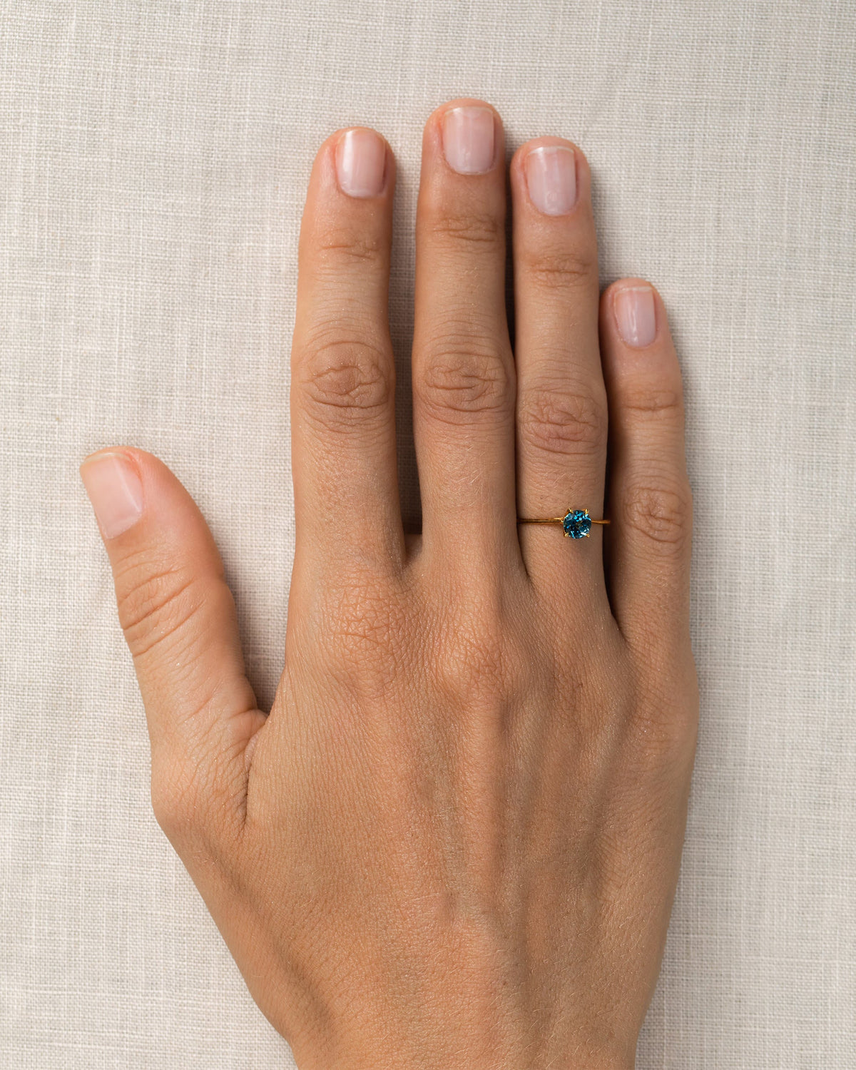 London blue topaz gemstone rings in gold on model