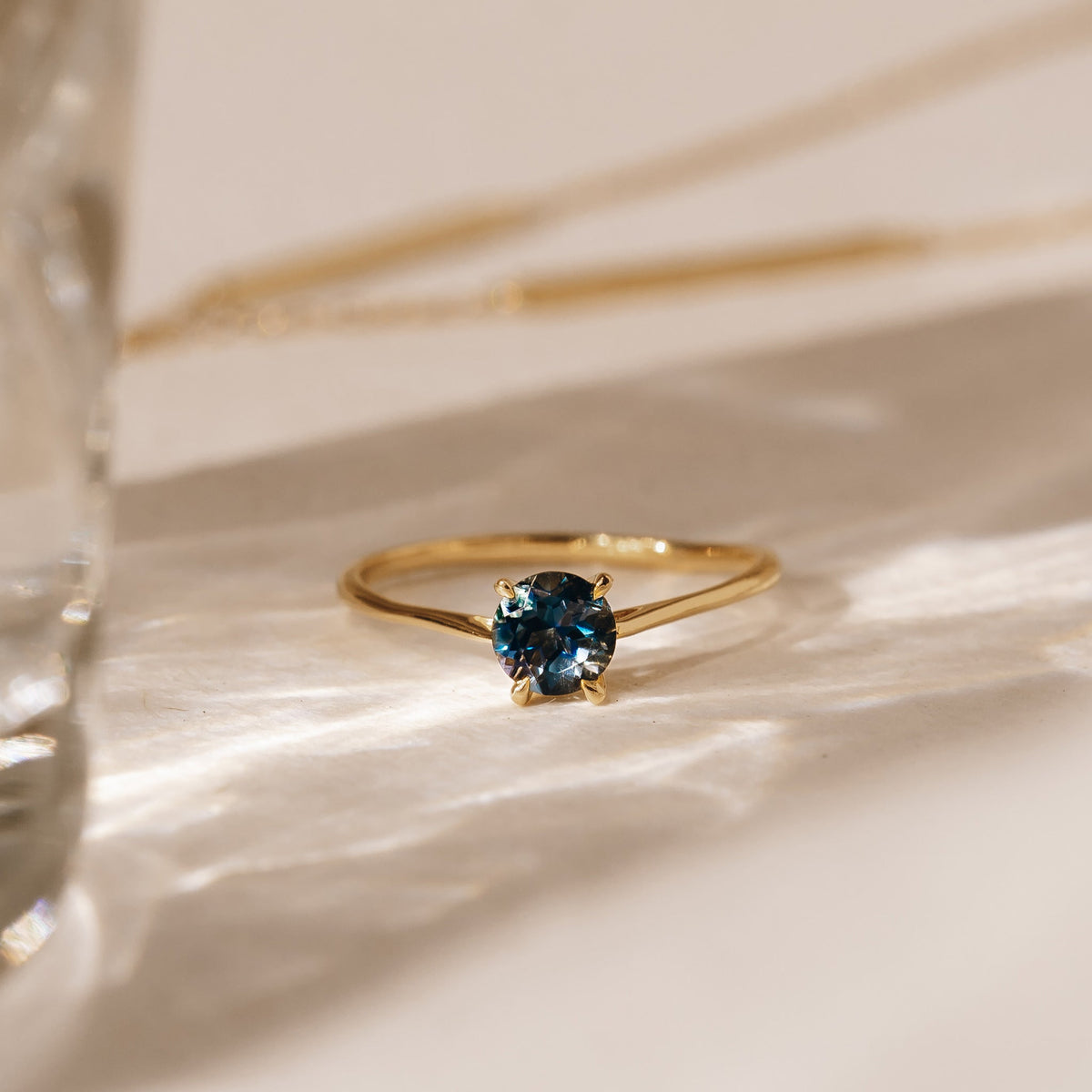 Gold solitaire gemstone ring